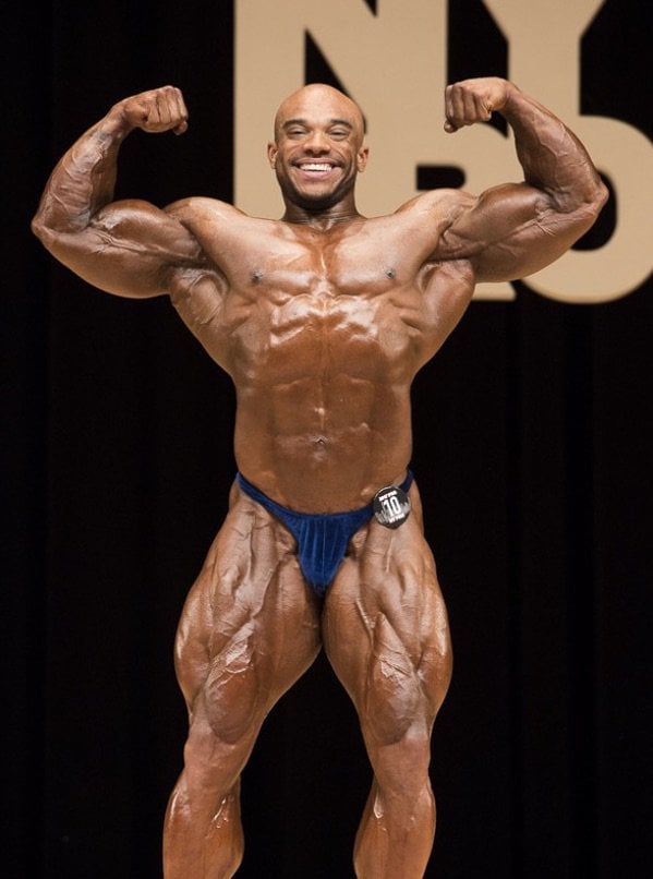 6 ft. Tall, Shredded Bodybuilding Beast, Sergio Oliva Jr., Dwarfed
